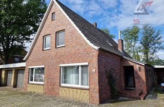 Einfamilienhaus kaufen in 26670 Uplengen, Wohnhaus mit 3 Garagen und großem Grundstück!