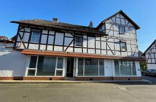 Wohnung kaufen in 37276 Meinhard, Wohnhaus mit Gewerbefläche und Garage