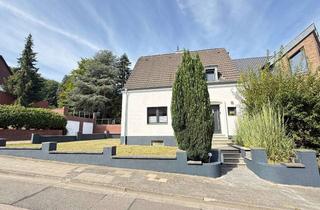 Doppelhaushälfte kaufen in 41517 Grevenbroich, Familienidyll in Neuenhausen – modernisierte Doppelhaushälfte mit Garten & Garage