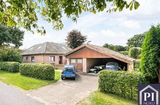 Haus kaufen in 24793 Brammer, Wohnen auf einer Ebene - Winkelbungalow mit Garage und Doppelcarport