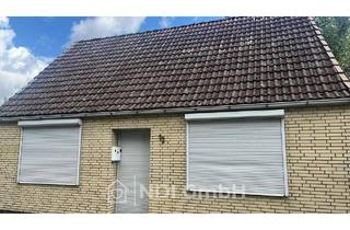 Einfamilienhaus kaufen in 25436 Uetersen, Uetersen - Einfamilienhaus mit großem Grundstück, Garagen und Entwicklungspotenzial in Uetersen