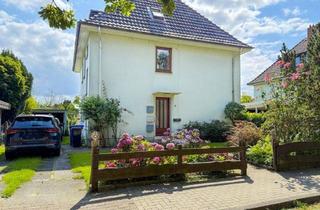 Wohnung kaufen in 27721 Ritterhude, Ein Zuhause mit Gartenidylle! 4 Zimmer-Erdgeschosswohnung mit Garage und besonderem Charme
