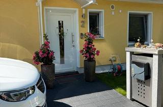 Haus kaufen in 91469 Hagenbüchach, Hagenbüchach - Freistehenden Winkelbungalow mit Wintergarten und Terrasse