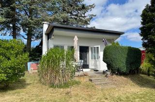 Haus kaufen in Bungalowsiedlung Drigge E.v. 20, 18574 Gustow, Kleiner idyllischer Ferienbungalow mit möglichem Bootsliegeplatz auf der Insel Rügen zu verkaufen