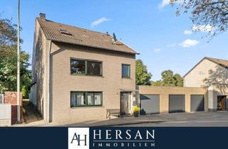 Einfamilienhaus kaufen in 52382 Niederzier, Niederzier / Ellen - Freistehendes Einfamilienhaus mit drei Garagen und Wintergarten - Mehrgenerationenhaus geeignet!