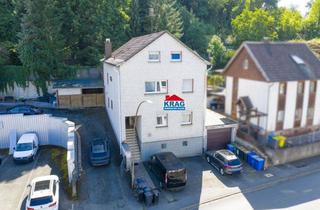 Haus kaufen in 35075 Gladenbach, ++ KRAG Immobilien ++ Solides Anlageobjekt mit Garage und Teilkeller | vermietet | provisionsfrei