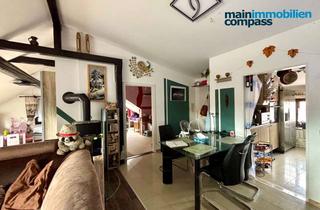 Wohnung kaufen in 61184 Karben, Helle Dachgeschosswohnung mit Weitblick – Wohnen über den Dächern