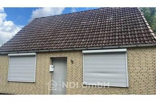 Einfamilienhaus kaufen in 25436 Uetersen, Einfamilienhaus mit großem Grundstück, Garagen und Entwicklungspotenzial in Uetersen
