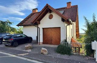 Einfamilienhaus kaufen in 35519 Rockenberg, Harmonievolles Einfamilienhaus mit Einliegerwohnung – Hanglage mit Weitblick