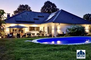 Haus kaufen in 19399 Langenhagen, Luxuriöses Wohnen am See: Moderne Familienresidenz mit Pool