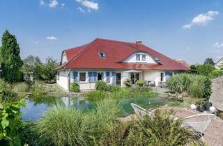 Villa kaufen in 61440 Oberursel (Taunus), Stilvolle Architektenvilla auf Traumgrundstück mit Schwimmteich