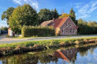 Haus kaufen in 26629 Großefehn, Fehnhaus mit Doppelgarage direkt am Großefehnkanal