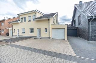 Doppelhaushälfte kaufen in 48268 Greven, Attraktive Doppelhaushälfte mit neuer Fassade und Garage in familienfreundlicher Lage