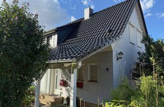 Doppelhaushälfte kaufen in 38364 Schöningen, Gemütliche Doppelhaushälfte mit Garage und Gartenteich in Schöningen