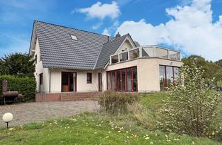 Anlageobjekt in Am Bodden 25, 18528 Buschvitz, Attraktives Ferienhaus mit vier Wohneinheiten in Buschvitz und Wasserblick