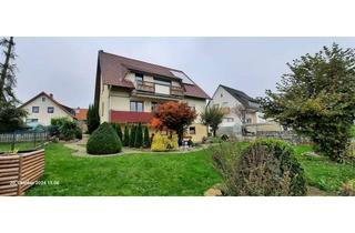 Wohnung kaufen in 73268 Erkenbrechtsweiler, EG-Wohnung mit zusätzlichem Gartengeschoss und großem Garten