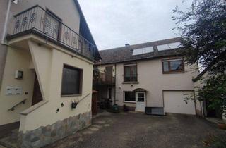 Haus kaufen in 56218 Mülheim-Kärlich, Vielseitige Immobilie mit zwei Häusern und vier Garagen - Mehrgenerationenhaus oder Kapitalanlage