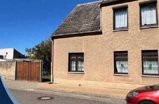 Doppelhaushälfte kaufen in 39606 Osterburg, Doppelhaushälfte mit großem Grundstück in Osterburg