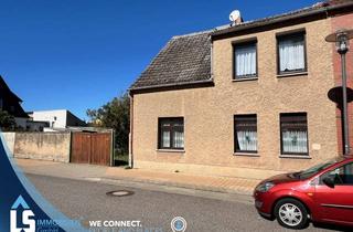 Doppelhaushälfte kaufen in 39606 Osterburg, Doppelhaushälfte mit großem Grundstück in Osterburg