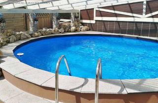 Doppelhaushälfte kaufen in 91792 Ellingen, Schöne Doppelhaushälfte als private Wellnessoase – mit Pool, Werkstatt, Carport und Garten