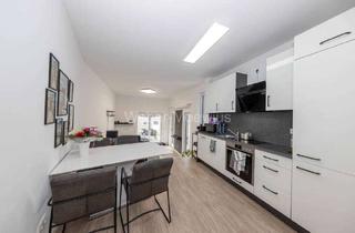 Wohnung kaufen in 50181 Bedburg, Neuwertige Maisonette-Wohnung mit Terrasse und Garage