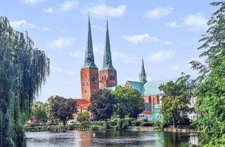 Wohnung kaufen in 23552 Innenstadt, Stilvolle 2-Zi.-Neubauwohnung auf der Altstadtinsel mit XL-Stellplatz, Loggia und Blick auf den Dom!