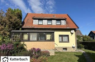 Haus kaufen in 38685 Langelsheim, Gemütliches Ein- bis Zweifamilienhaus mit Wintergarten und drei Garagen im idyllischen Bredelem