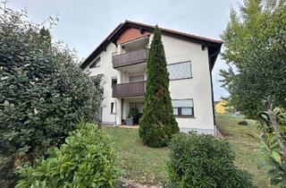 Wohnung kaufen in 63939 Wörth, Vermietete 3-Zimmer-Erdgeschosswohnung mit Terrasse und Gartenzugang