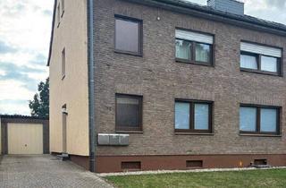 Doppelhaushälfte kaufen in 50181 Bedburg, Bedburg - ZUM VERKAUF: Mehrparteienhaus mit 3 Mieteinheiten, Garten und Garage