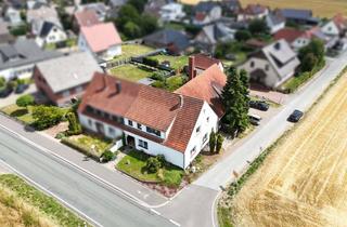 Haus kaufen in 32609 Hüllhorst, Top-Investment mit Potenzial: Zwei Wohnungen plus Gewerbe in Hüllhorst