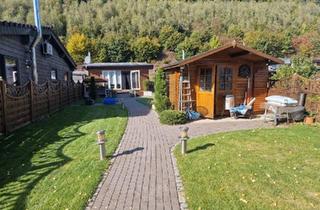 Haus kaufen in 32832 Augustdorf, Augustdorf - Charmantes Ferienhaus am See mit Steg, Sauna & Smart-Garten