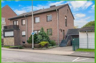 Doppelhaushälfte kaufen in 52134 Herzogenrath, Doppelhaushälfte mit zwei Garagen, Terrasse und großem Garten.