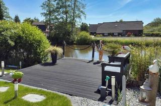 Wohnung kaufen in 26553 Dornum, Direkt am Wasser! Stilvolle Wohnung mit hochwertigem Keller