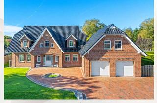 Einfamilienhaus kaufen in 26532 Großheide, Modernes Einfamilienhaus mit Erdwärme, Schwimmteich und ruhiger Gartenidylle