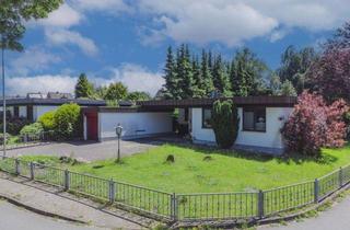 Einfamilienhaus kaufen in 24782 Büdelsdorf, Stylischer und familiengerechter Flachdachbungalow in wunderbarer grüner und ruhiger Lage