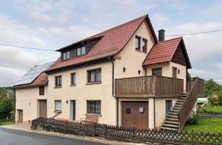 Haus kaufen in 91278 Pottenstein, Teilvermietetes Zweifamilienhaus mit pflegeleichtem Garten, Scheune und zwei Garagen in Kühlenfels