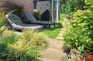 Wohnung kaufen in 47495 Rheinberg, Rheinberg-Borth - Gemütliche Souterrainwohnung mit Terrasse, Garten und zwei PKW-Stellplätzen in Rheinberg-Borth