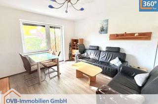 Wohnung kaufen in 26736 Krummhörn, Attraktive Erdgeschosswohnung mit Terrasse und Garten in Greetsiel