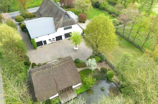 Haus kaufen in 25370 Seester, Reetgedecktes Landgut mit zwei Wohneinheiten und XXL Garage