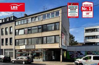 Mehrfamilienhaus kaufen in 47798 Stadtmitte, Mehrfamilienhaus mit 9 Wohnungen, einem Gewerbe und 7 Garagen