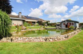 Anlageobjekt in 21726 Oldendorf, Familienparadies am Feldrand – Bungalow mit PV-Anlage, Schwimmteich und Sauna