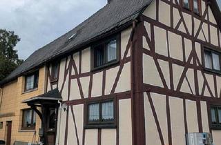 Haus kaufen in 35768 Siegbach, Siegbach - Charmantes Fachwerkhaus mit Nebengebäuden zu verkaufen