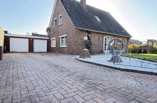 Einfamilienhaus kaufen in Emder Weg 17, 26529 Wirdum, Einfamilienhaus mit großer Garage, Keller und Eigentumsgrundstück.