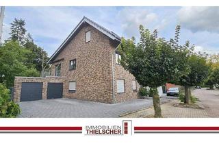 Doppelhaushälfte kaufen in 52511 Geilenkirchen, Geilenkirchen / Waurichen - Attraktives Zweifamilienhaus mit angrenzender Doppelhaushälfte, Stellplatz und zwei Garagen