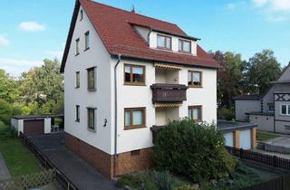 Haus kaufen in 34266 Niestetal, Niestetal - 3-Familienhaus mit Balkonen auf großem Grundstück mit Garagen in Niestetal-Sandershausen