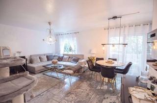 Wohnung kaufen in 65428 Rüsselsheim, Charmante Erdgeschosswohnung mit Garten und moderner Ausstattung