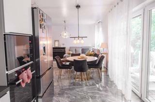 Wohnung kaufen in 65428 Rüsselsheim, Charmante Erdgeschosswohnung mit Garten und moderner Ausstattung