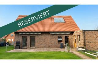 Einfamilienhaus kaufen in 26434 Wangerland, Nordseenahes Einfamilienhaus mit Kamin, großer Garage und gepflegtem Garten in Hooksiel