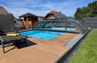 Einfamilienhaus kaufen in 54552 Steiningen, Modernes Einfamilienhaus mit Einliegerwohnung, Wintergarten und beheiztem Pool auf großem Grundstück