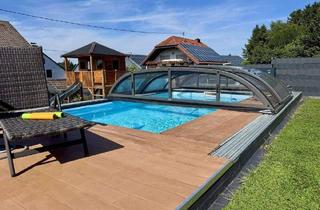 Einfamilienhaus kaufen in 54552 Steiningen, Steiningen - Modernes Einfamilienhaus mit Einliegerwohnung, Wintergarten und beheiztem Pool auf großem Grundstück